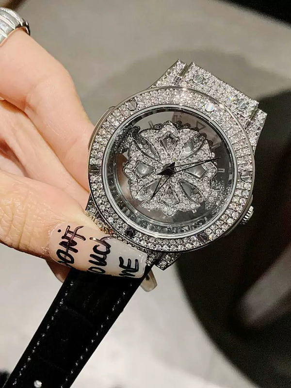 蒂米妮韩版满钻气质旋转表盘进口机芯镂空透明皮带镶钻女士手表